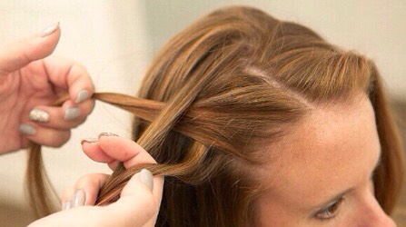 Take a new section of hair from the top of your head, and let it fall on the top section you just pulled away from your face💫
