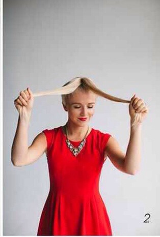 2. Figure out where you would like to part your hair; if it is in the middle you would take the ponytail and split it in equal parts, if it is off to the left, the right side would have more hair, etc.