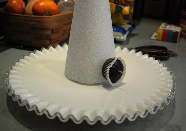 Dye your frosting with food coloring to get the green you like and get your cake decorating tips out. Once the cupcakes are placed on the cone, start frosting! Again, from the bottom to the top.