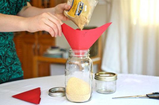 9. Instead of wasting cabinet space with a funnel, just use an envelope. Simply snip a hole in one of the sealed corners of an envelope and you can funnel to your heart's content.