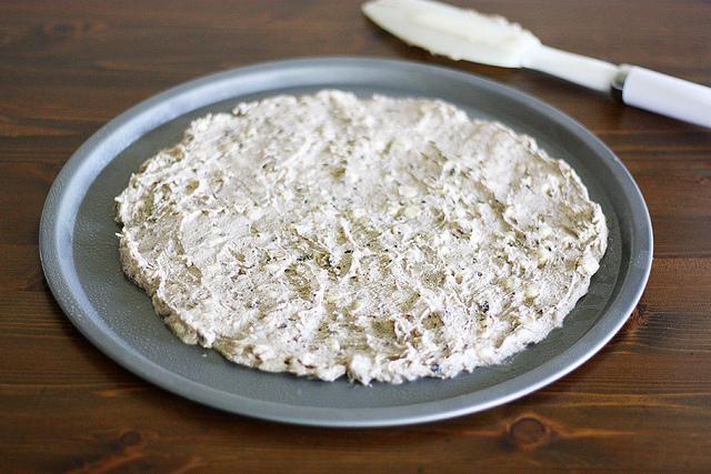 Combine cookie mix, softened butter and water in a large bowl; stir until a dough forms. Press dough into a 12-inch circle on prepared pizza pan.