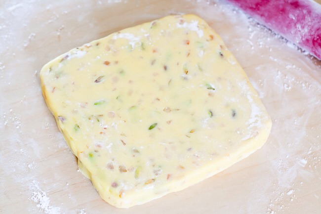 3.Using a small amount of icing sugar to stop the marzipan from sticking, roll out to a height of about 2cm.