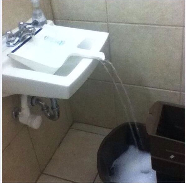 Use a clean dustpan to fill a container that doesn't fit under the tap