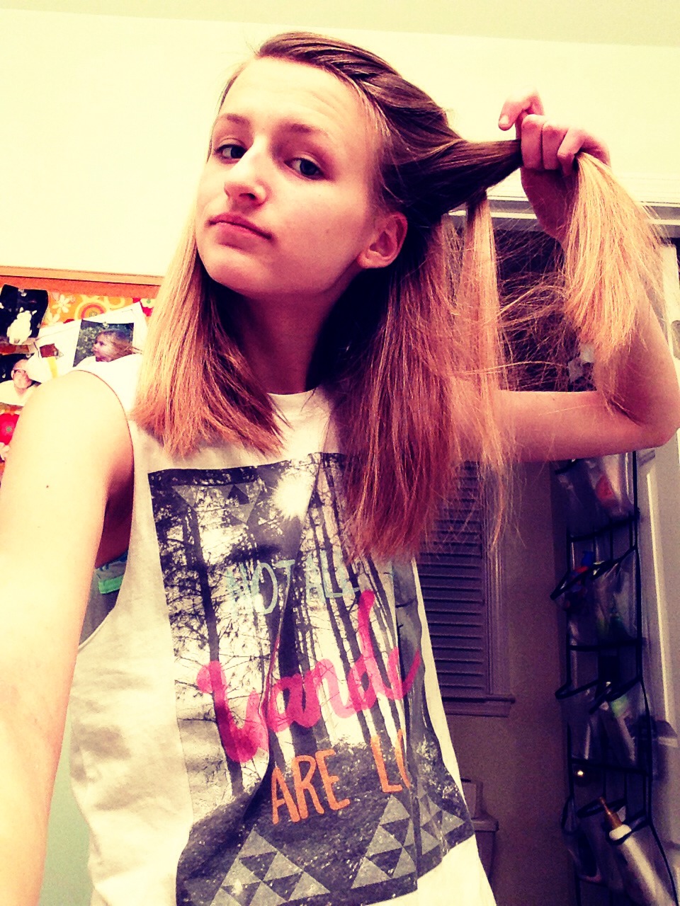 Then take the first strand and add more hair to it then twist it around the second strand again