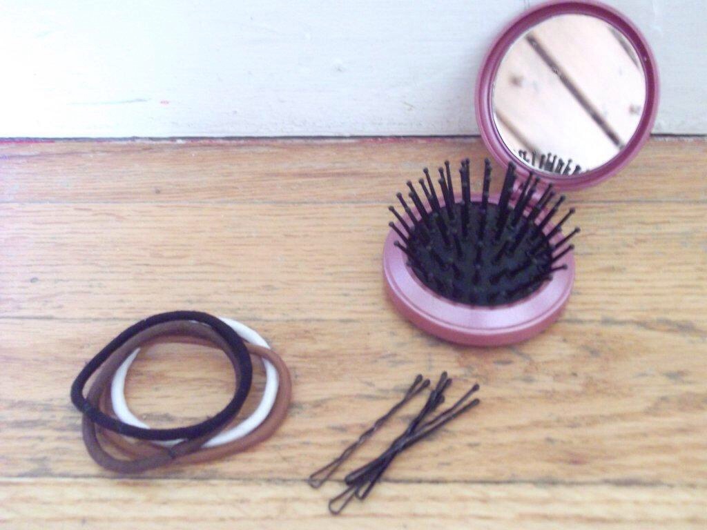 Hair ties, bobby pins, and a push up hair bush. Just if you need to fix your hair.