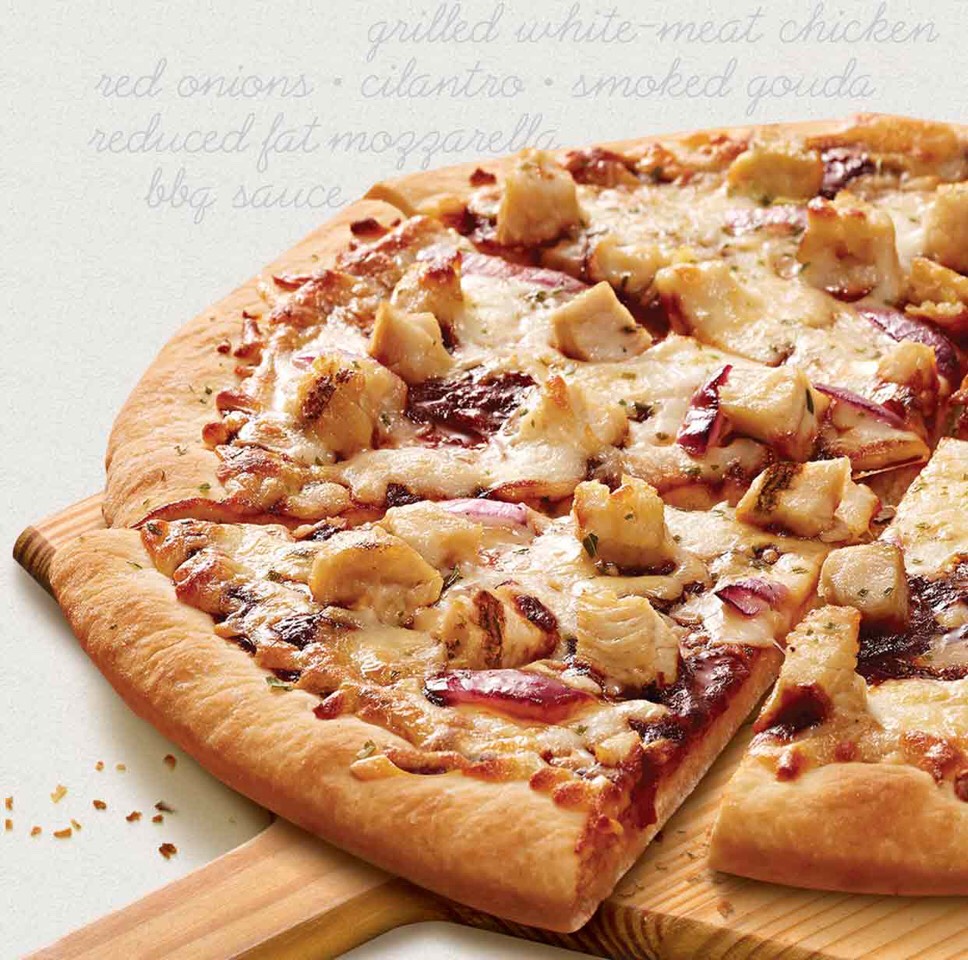26. BBQ Chicken Stretch dough into a 15-by-9-inch rectangle. Top with cooked chicken, 1/4 cup barbecue sauce, scallions, pickled jalapeños and 1 cup shredded cheddar. Bake until golden.