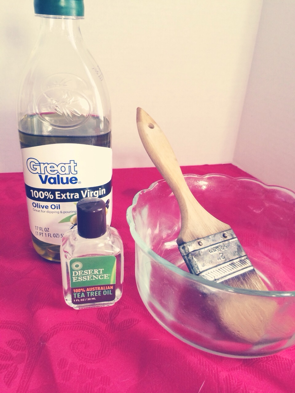 Depending on your length & thickness of hair, use your discretion on amt. of olive oil. Mix about 1tsp. pure tea tree oil (yes it's strong but worth it) heat in microwave for about 50sec depending on microwave. Fill sink with hot H2O to keep warm