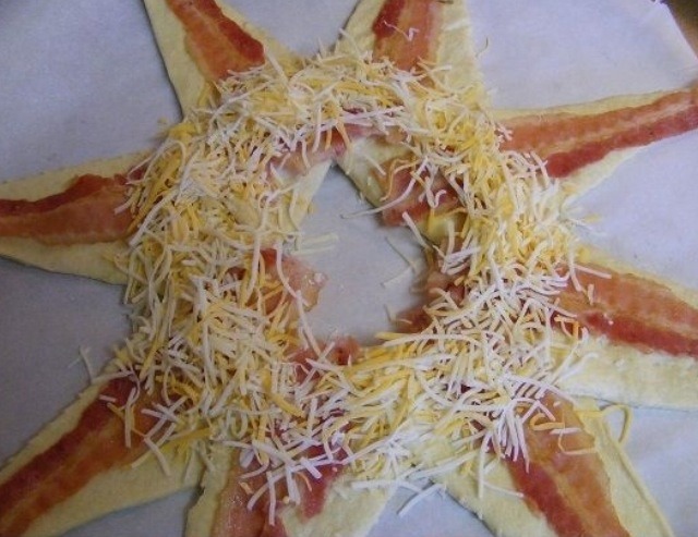 Add grated cheese and scrambled eggs. You may add any other ingredients you like as well like veggies or grilled chicken