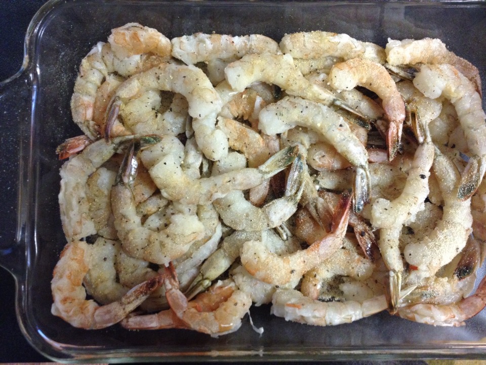 Place your shrimp on top of your seasoning mixture and sprinkle more of that same mix on top.