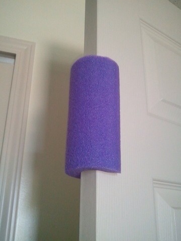 19. Repurpose a pool noodle to become a toddler-proof door stopper.