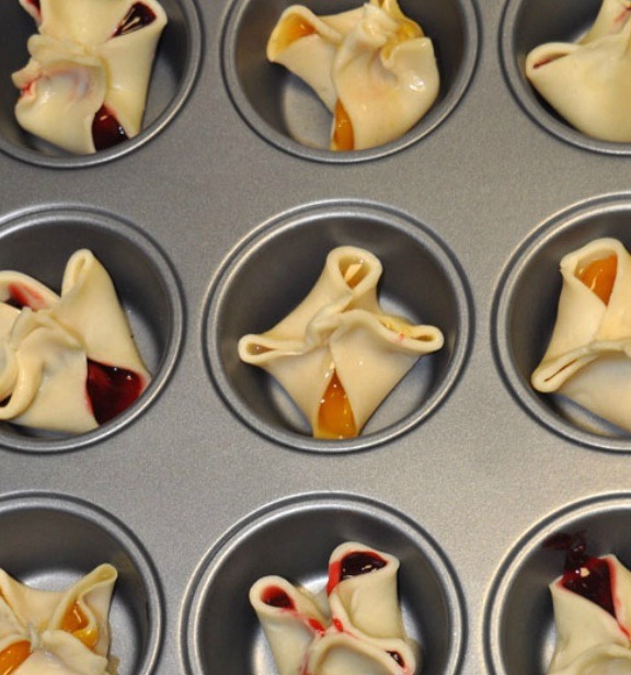 Step 2: Add a teaspoon or two of your favorite filling to each square and pinch shut.

Step 3: Place each pie in a muffin cup and bake at 450 for 10-15 minutes or until golden.