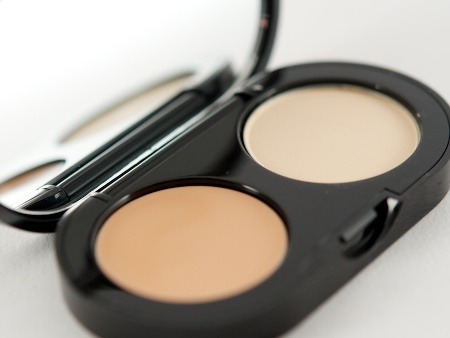 For smudge-proof eye makeup, take a  blotting tissue to remove any excess oil any makeup from this specific area. Then apply a small amount of cream concealer to hold things in place.