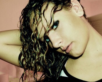 So you wanna start by dampening your hair with the spray bottle