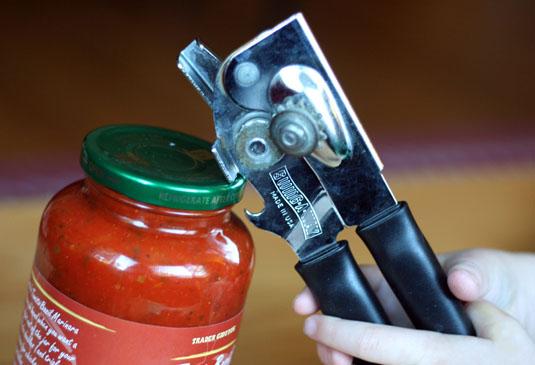 4. Open jars instantly with a bottle opener. Gently lift the edge of the jar's lid until you hear the seal pop, and then unscrew like normal.
