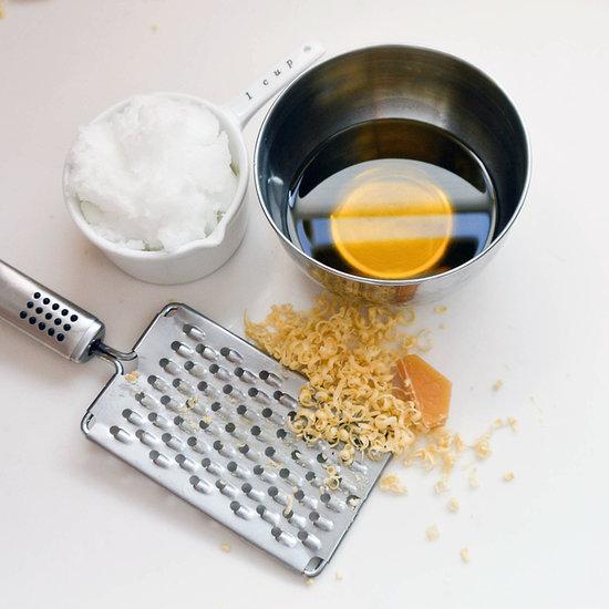 place the olive oil and coconut oil and the grated beeswax in a metal or glass bowl and heat over a double broiler or just one pot with a little water in it and place the bowl on top. once everything is melted give it a stir and remove from heat