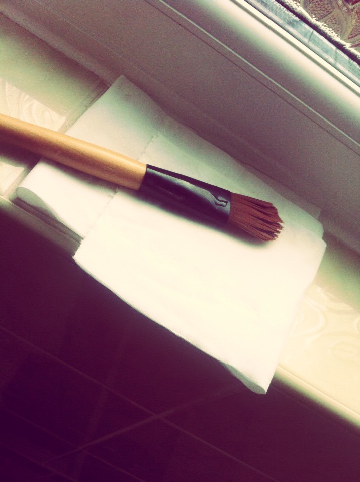 Squeeze your brush to get rid of excess water then lay it out on your towel or toilet/kitchen roll to dry for a few hours.