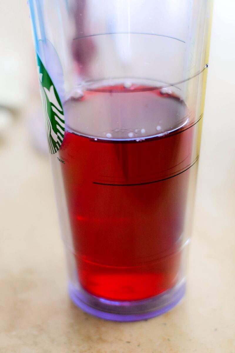 I used a Starbucks cup, which they sell in their stores, and filled the cup up to the second line ( about 9 oz).