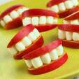 cut apple slices and put a row of marshmallows in between two slices to make apple-marshmallow teeth ;-)