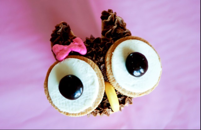 For the eyes use two halves of white Oreos, put a chocolate m&m in the center and a banana hard candy for the nose. 