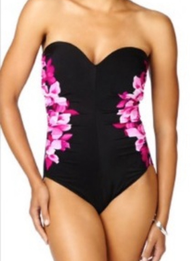 Broader shoulders - try looking for a solid colour with printed down the side as this will give the illusion of an hour glass figure ...