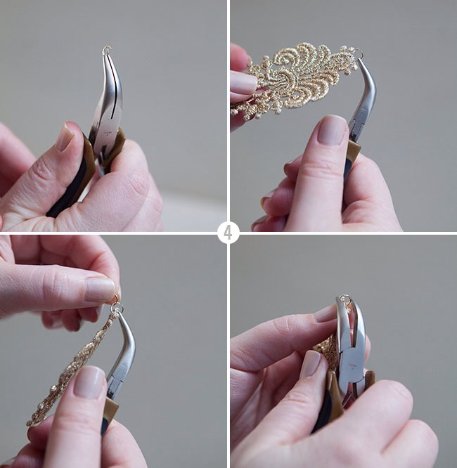 Using your pliers slightly bend one jump ring open and slip it through either the stitching of your applique or through an open space in the design and then pinch that jump ring closed. Add a second jump ring onto the first, which makes a bit of a chain and close that jump ring as well.
