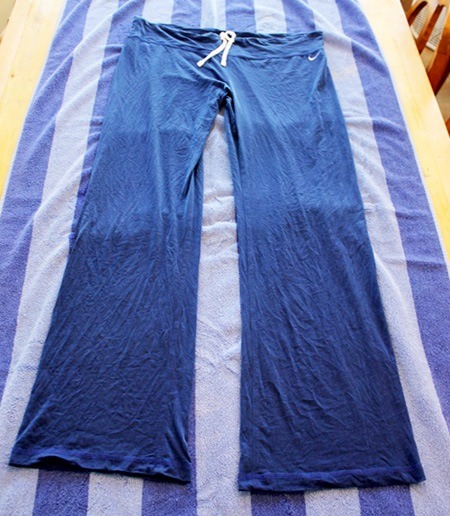 Take a large towel and lay the clothing flat on it.