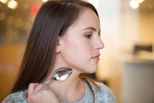 12. Reduce the size of a hickey or a bruise by rubbing a cold spoon on top. Put a spoon in your freezer, and once it's cold, rub the back of it against a new bruise or a hickey to slow the blood from rushing to the area and help it fade.