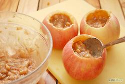 Spoon the filling back into each apple. Fill about 3/4 of the way to prevent spillage of filling while baking.