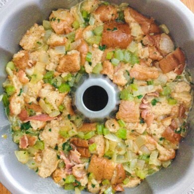 3. In a large bowl whisk together the turkey stock, eggs, and minced parsley. Add in the cubed dry bread and stir to combine. Add in the cooked vegetables and stir to mix everything together. Transfer this mixture to the bundt pan.