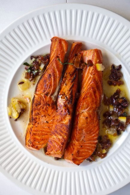 Simple Seared Salmon

This  process of cooking salmon easily and perfectly — it's real fast food! 
6 ounces salmon, skin off, cut into 2-ounce pieces
2 tablespoons olive oil

Set a large cast-iron skillet over high heat.

As the skillet is heating up, season the salmon with salt and pepper.
