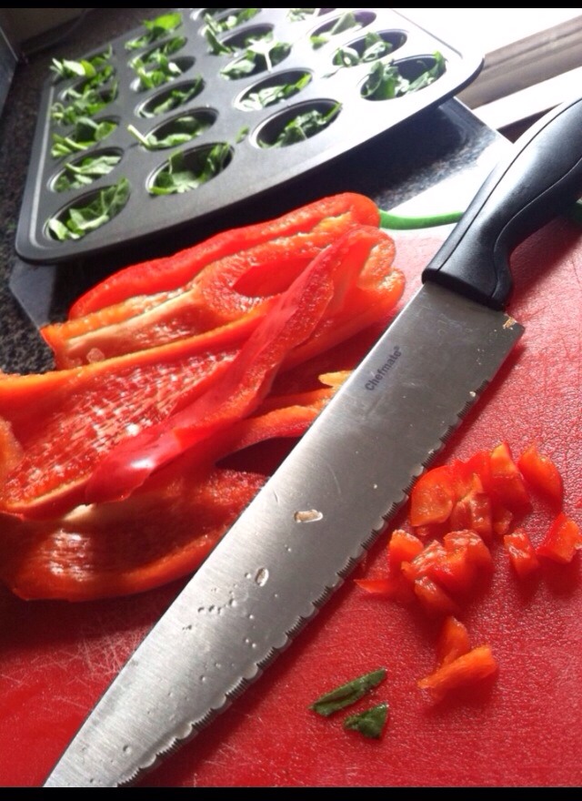 Step 2:
Cut up and fill each tin with veggies. Spinach and Red Pepper was used here.