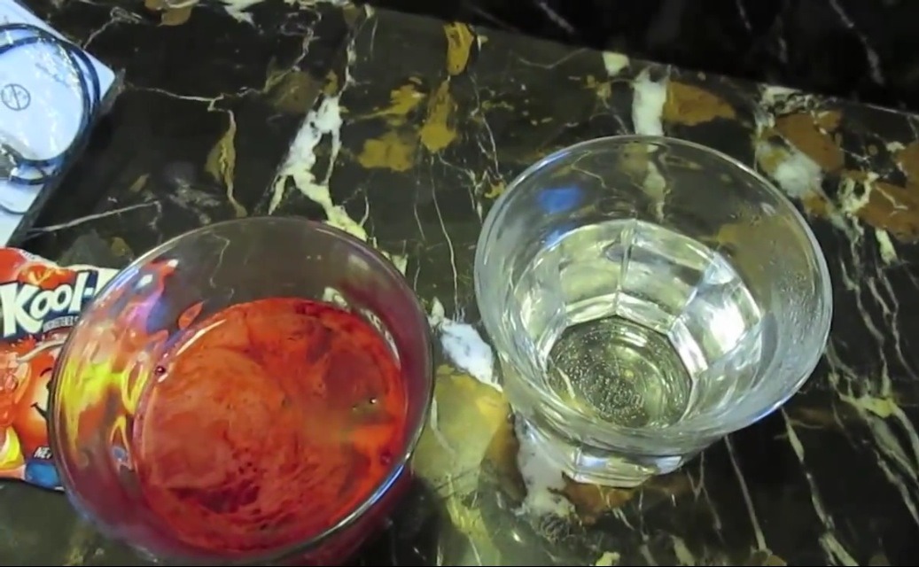 Now with two bowls, glasses (your choice), pour hot water in your container. After you pour it in you can add a full packet of Kool-aid to each container. Or half a packet, but full packets contain more vibrance. 