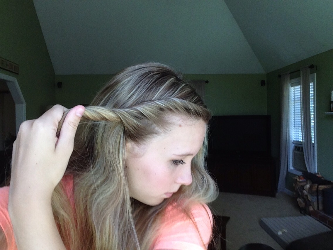 Keep adding other pieces of the hair around your face as you twist down towards your ear, almost like a French braid except without the braid.