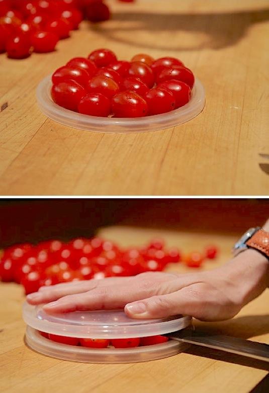 31. Cherry Tomato Hack
If you are using them for a salad or other dish, here is a trick using 2 plastic lids to cut them quickly! Make sure you are using a large, sharp knife and being careful.
