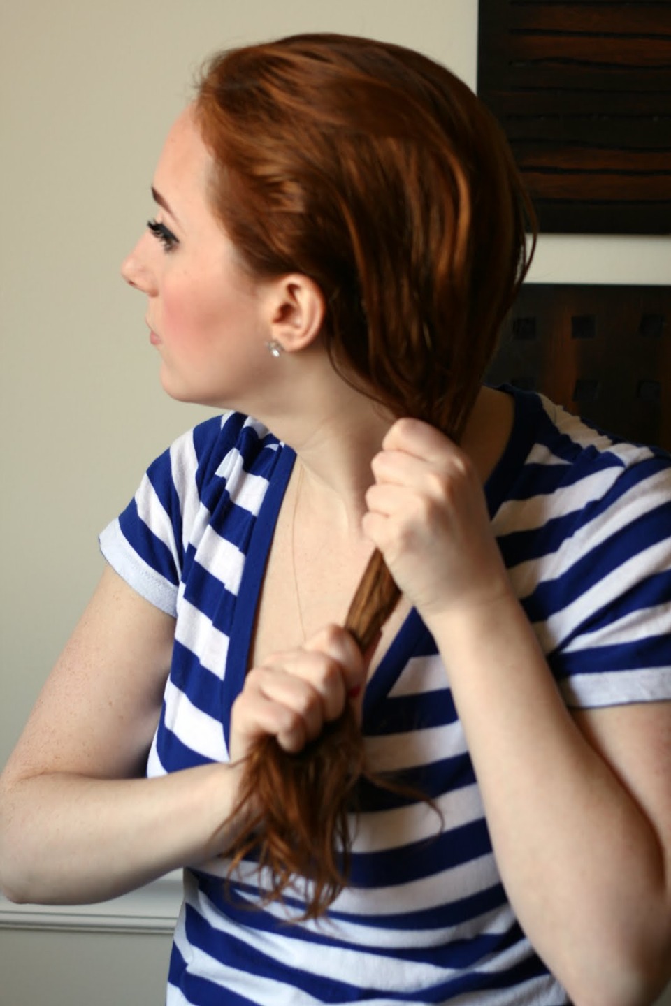 Next: apply the oil onto your hair(roots then ends) until all your hair is covered 