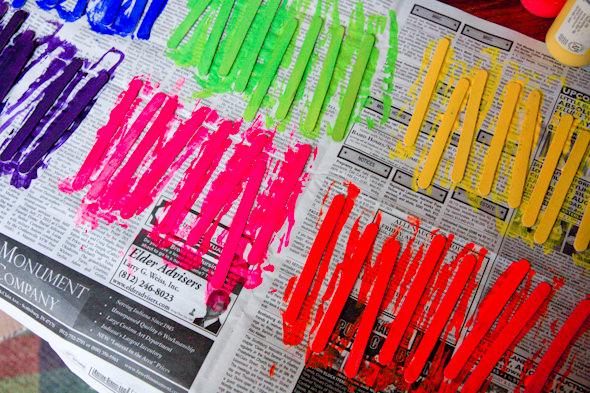 I started by painting popsicle sticks in six different colors.