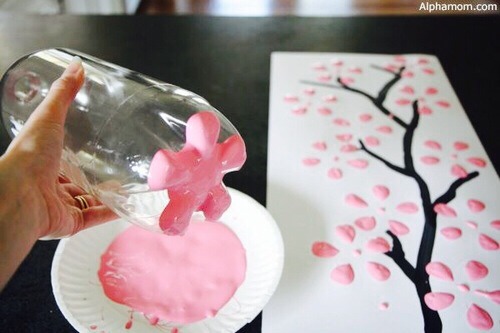 Get the bottom of a bottle and dip it in paint