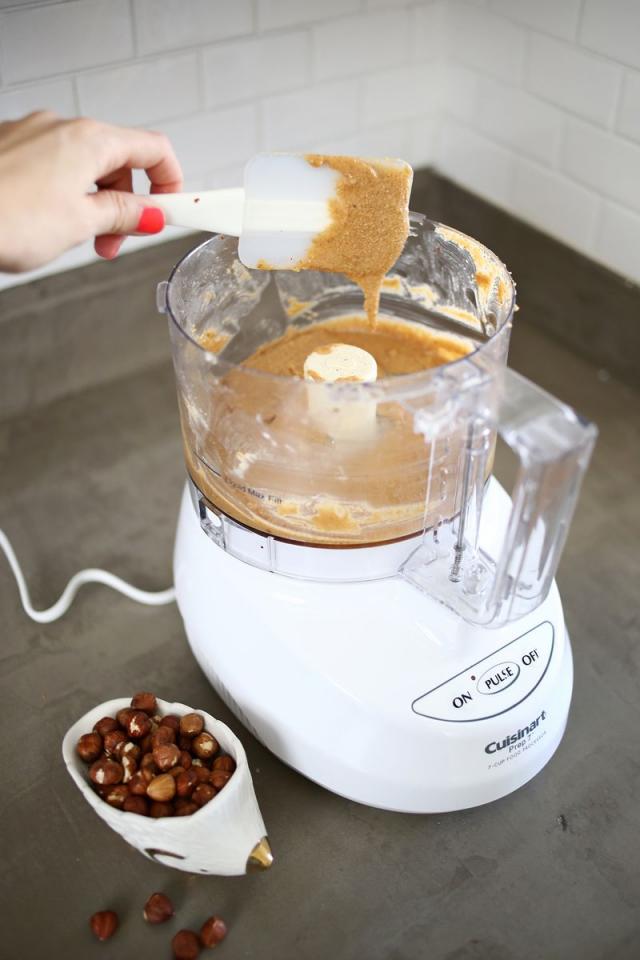 Transfer your de-shelled hazelnuts to a food processor and blend together until they become smooth and creamy. Our food processor isn't anything fancy, and it only took about two minutes for the hazelnuts to turn into butter, but you may have to blend longer depending on your machine.