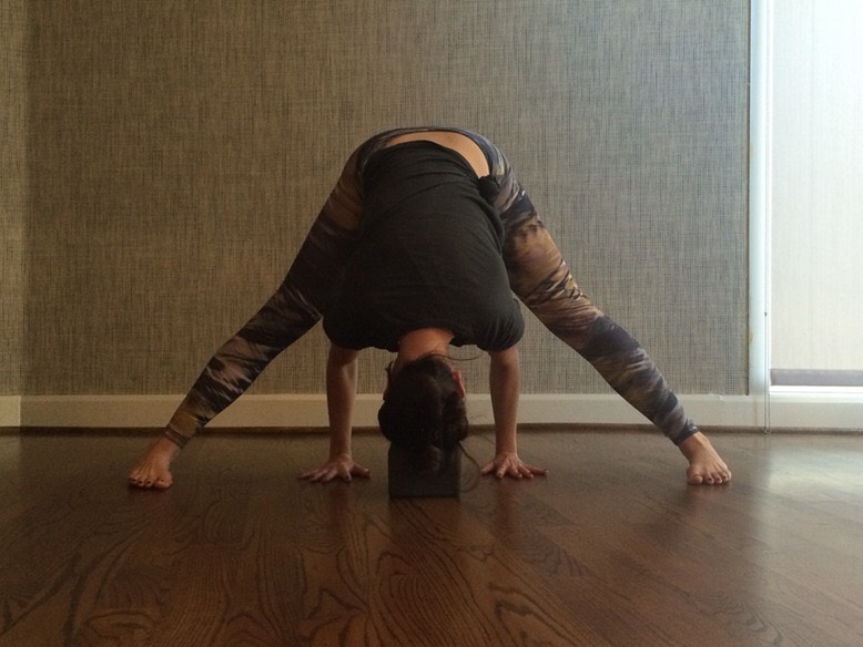 WIDE LEGGED FORWARD FOLD
Forward bends are a great way to calm the body and the nervous system after a long day. Doing a wide-legged forward fold will help open and stretch the back body.