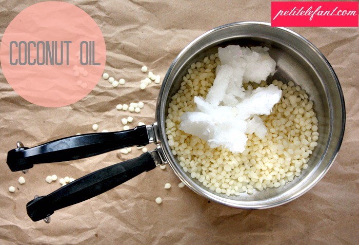 When it’s completely melted, add coconut oil using a 2:1 ratio of coconut oil to beeswax (at least).  I started out with 1/2 cup of beeswax + 1 cup of coconut oil. Mix together until the beeswax + coconut oil are completely combined + have a thin, liquid consistency.
Using a dropper, grab some of the mix + squirt it out on a piece of wax paper.  When it has cooled down, test the lip gloss on your lips and see if it’s smooth or still has a waxy consistency.
