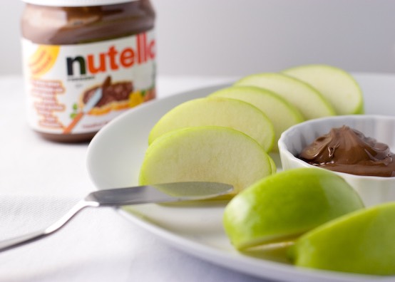 Apples and Nutella. 
Not completely healthy but not completely bad for you.