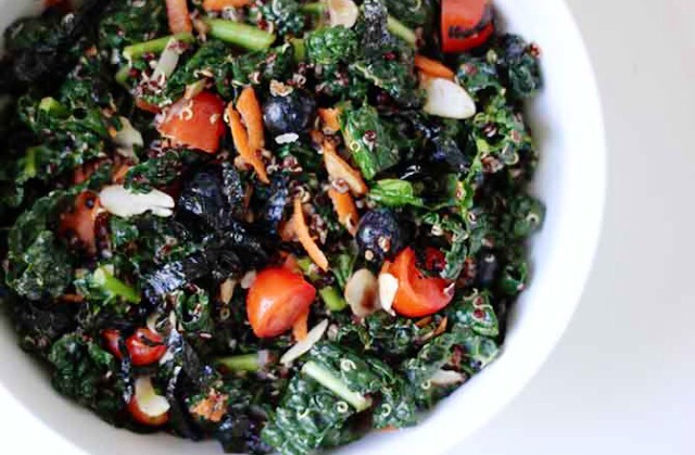 EAT QUINOA 
Quinoa's many nutrients include fiber and potassium, both of which are important if you'd like to feel less bloated. This superfood salad combines kale, quinoa, and blueberries for a delicious and filling lunch.