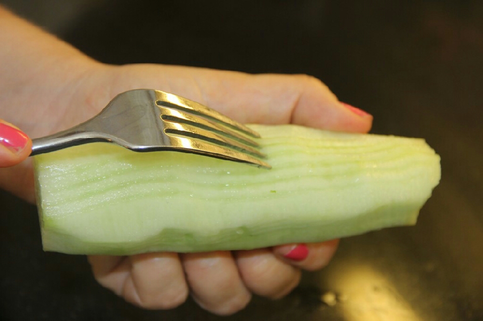 Then take a fork and run it from top to bottom all the way around your cucumber.