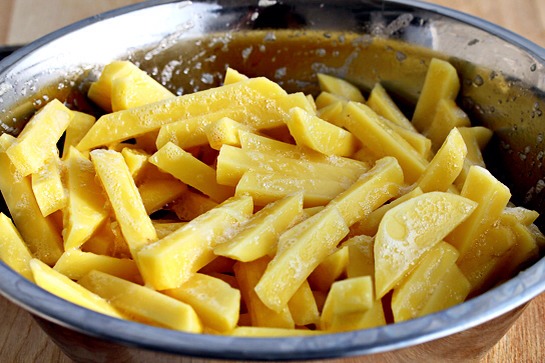 10. Dip the cut potatoes in egg to coat.