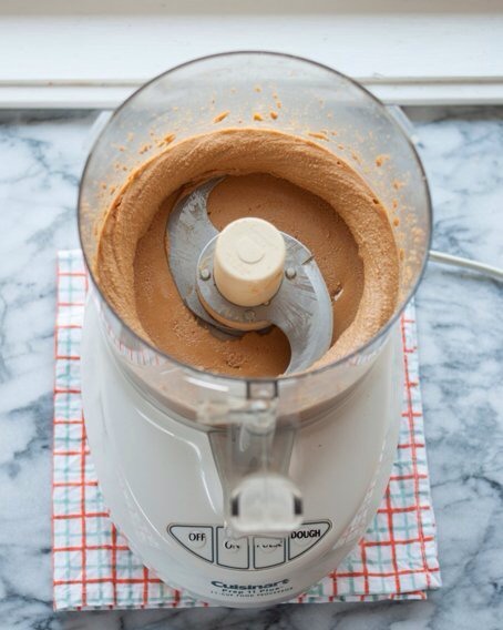 Continue to blend the butter until it becomes smooth, taste and season as needed with salt or any other seasonings, If you want chunky peanut butter then add the reserved 1/2 cup of peanuts.