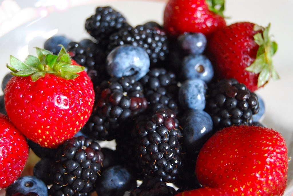 Now the fun part, pick any fruit you want. My personal favorite smoothie consists of mangos, banana, peach, and strawberries blended together. :) Don't be shy about the fruit, add as much as you want to the blender. 