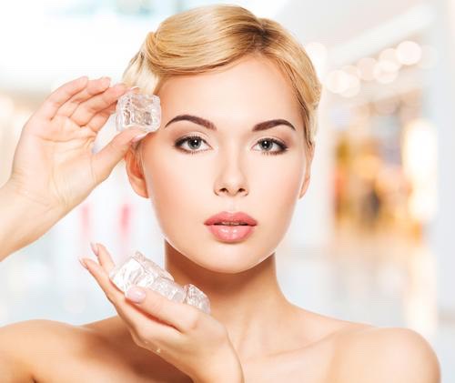 Next, grab one of your rose ice blocks and gently roll the ice all over your face and neck. Finish off with a spritz of rosewater.
