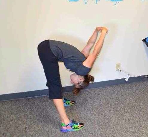 EXAMPLE OF TRIANGLE STRETCH. Pull your self to your legs with arms unlike in this picture.
