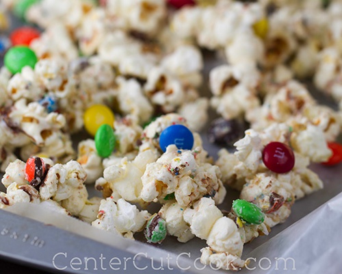 I don't exactly know what it's called so I'm gonna call it marshmallow chocolate popcorn. Yep that. So first take some marshmallows in a bowl and add 1tbs of water and melt it I te microwave for 20-30 sec intervals. Mix it with popcorn, add m&ms and voila! It tastes like heaven. I swear.