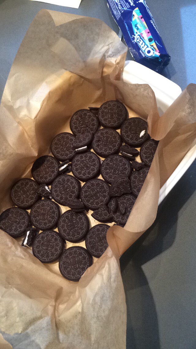Place Oreos at the bottom of a baking tray lined with baking paper.. I crumbled a few just fill gaps